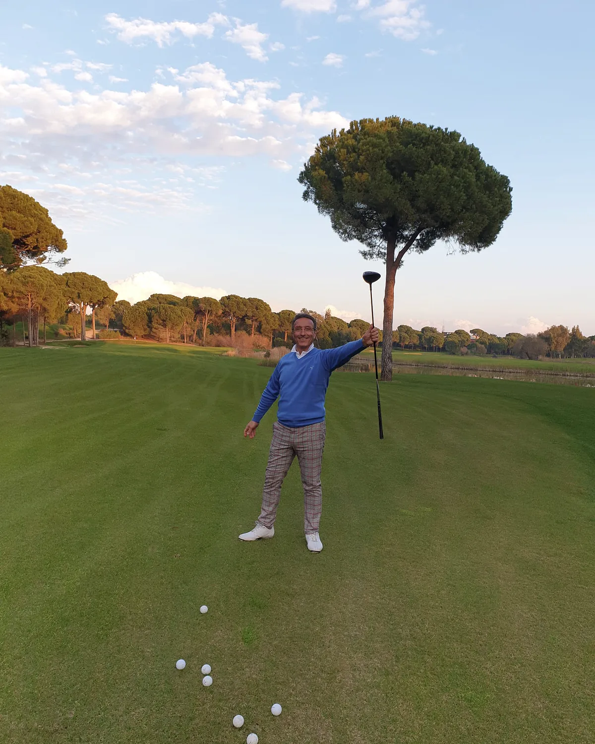 Mahmut Baran holding a driver on the practice ground